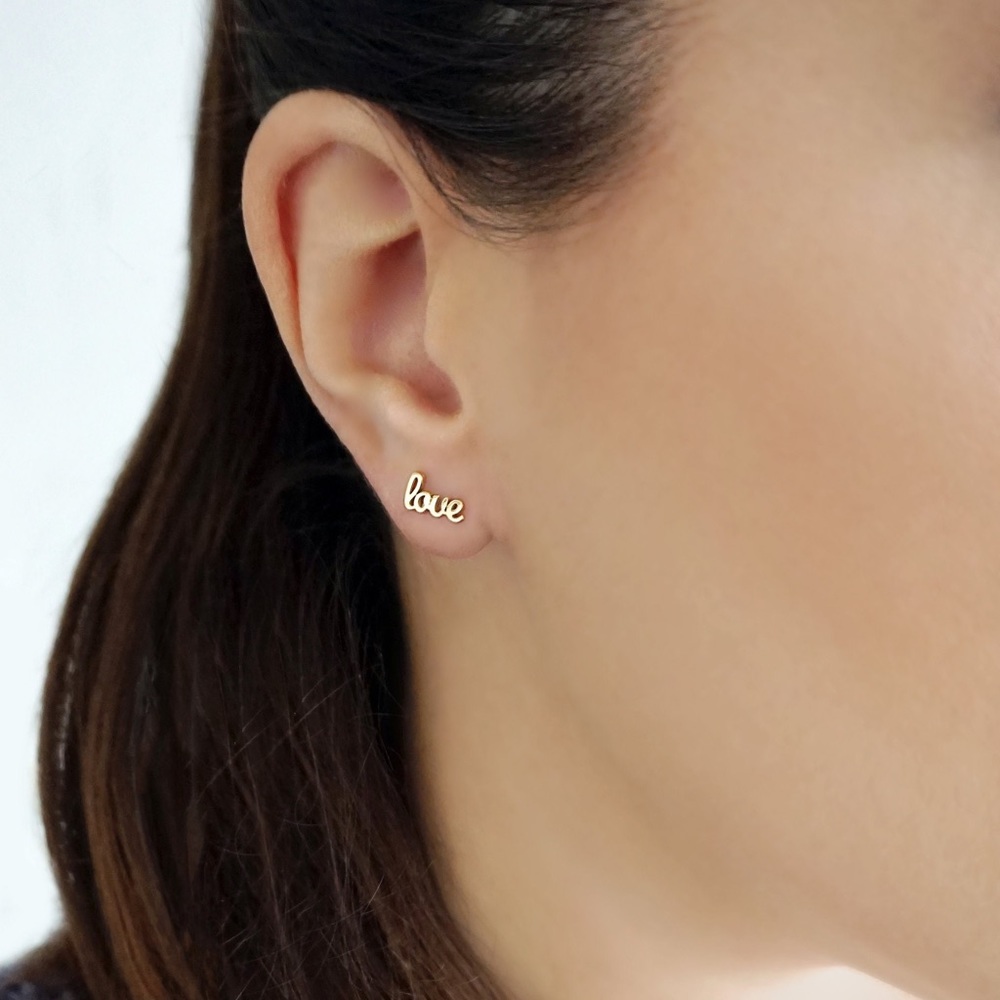Urban Outfitters A Little Love handwritten script earrings, gold.